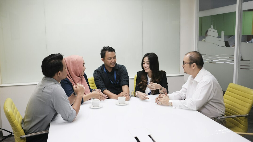 group of people in meeting agreeing
