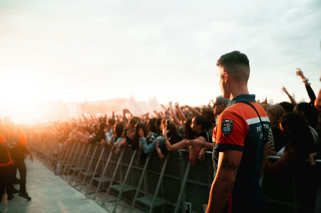 person standing alone in crowd
